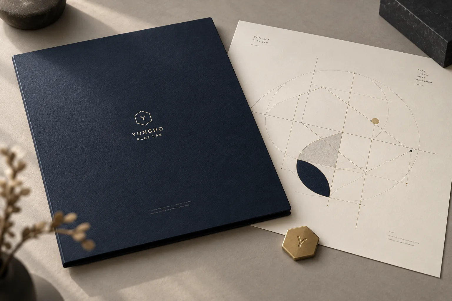 Yongho Play Lab identity and geometric research stationery — art-directed visualization
