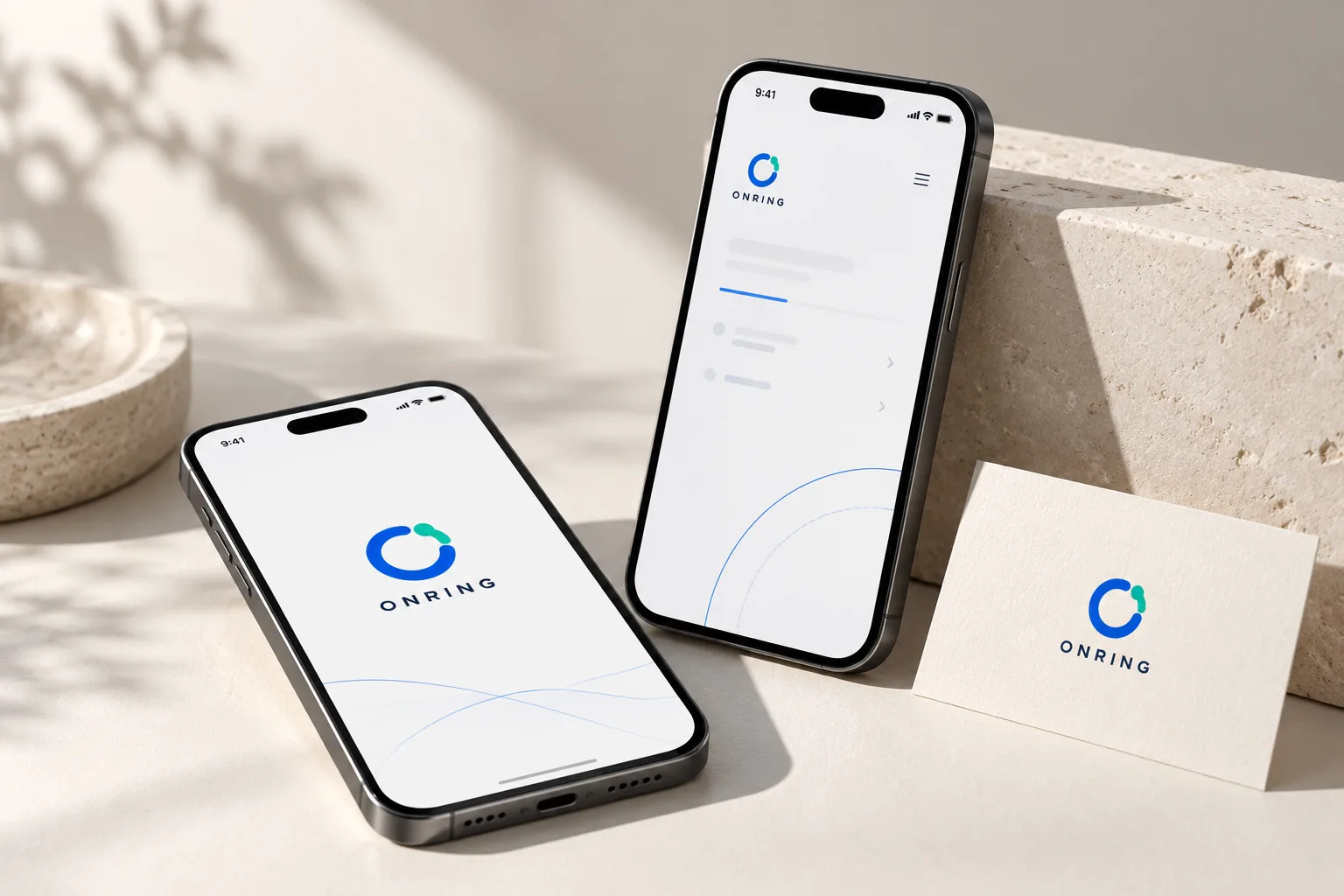 ONRING identity and mobile experience on two phones with brand stationery — art-directed visualization